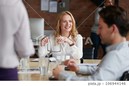Inspired to keep crafting success with her team. Shot of a young businesswoman having a meeting with her colleagues in an office. 106944146