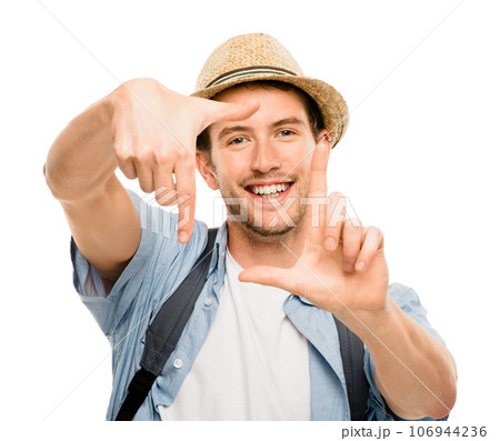 Framing up his gorgeous face. Shot of a young man framing his face against a studio background. 106944236
