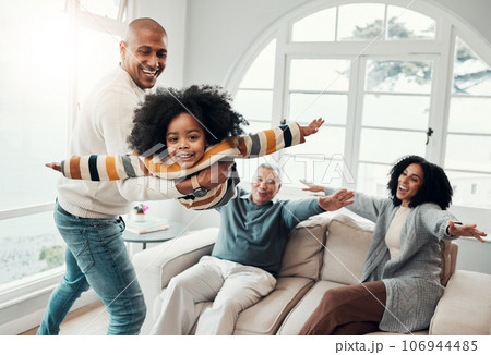 Airplane, father and girl in lounge, family an playing with love, quality time and cheerful together. Portrait, happy dad lifting daughter and granddad with mother, joyful and games in living room 106944485