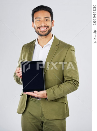 Happy asian man, portrait and tablet mockup in advertising against a white studio background. Businessman with technology display or screen in marketing, advertisement or branding on mock up space 106944830