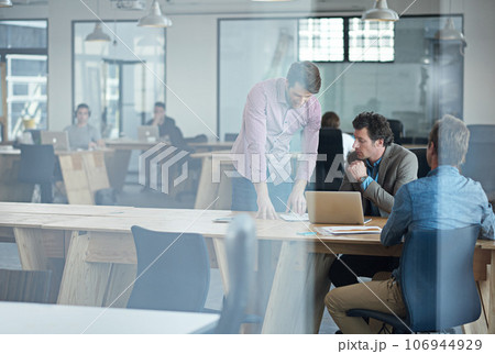 Manager, teamwork or business people in startup planning to design a project for collaboration. Laptop, online or mentor training, teaching or coaching employees for digital research behind glass 106944929