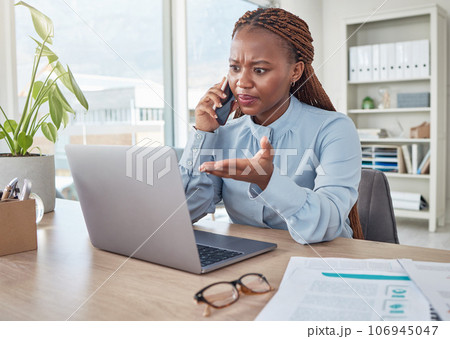 Angry, phone and stressed black woman on a business call about tax, audit and compliance email on laptop at office desk. Employee working mad, internet and tech glitch on the website of the company 106945047