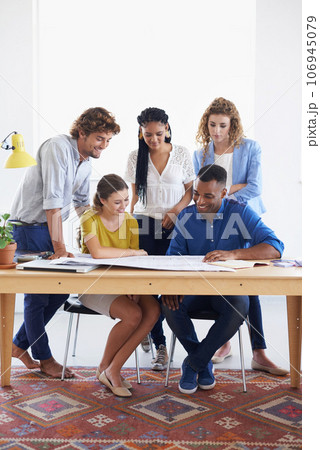 Happy business people, blueprint and meeting for planning, architecture or construction at office. Architect group working on paperwork in project discussion or floor plan in team collaboration 106945079