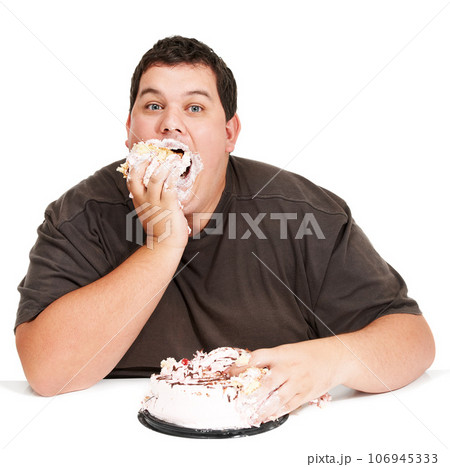 Cake, obesity and overweight man eating desert or unhealthy diet isolated in a studio white background. Hungry, face and portrait of a person with mouth full with sweets, sugar and calories Cake, obesity and overweight man eating desert or unhealthy diet isolated in a studio white background. Hungry, face and portrait of a person with mouth full with sweets, sugar and calories 106945333