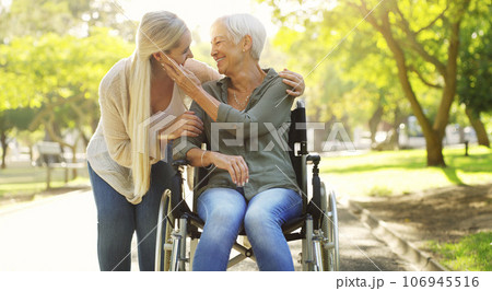 Hug, woman and senior mother at the park, wheelchair and happiness with joy, weekend break or bonding. Family, mature parent or daughter embrace, outdoor or relax with a smile, disability or recovery Hug, woman and senior mother at the park, wheelchair and happiness with joy, weekend break or bonding. Family, mature parent or daughter embrace, outdoor or relax with a smile, disability or recovery 106945516