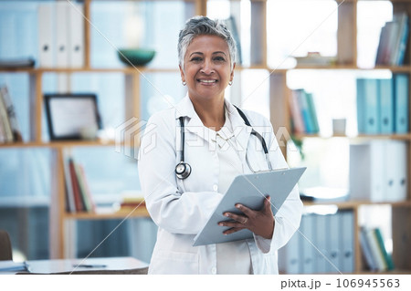 Senior woman doctor, portrait and checklist in clinic for inspection, healthcare paperwork or report. Female medic, clipboard and documents for results, analysis or diagnosis with smile at hospital Senior woman doctor, portrait and checklist in clinic for inspection, healthcare paperwork or report. Female medic, clipboard and documents for results, analysis or diagnosis with smile at hospital 106945563