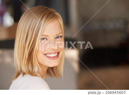 Young woman, smile and portrait with space for mockup, blurred background and happiness at workplace. Girl, mock up and copyspace for promotion, logo and happy with motivation, confidence or pride 106945607