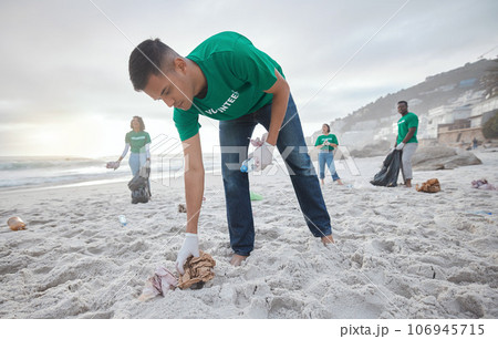 Teamwork, cleaning and recycling with man on beach for sustainability, environment and eco friendly. Climate change, earth day and nature with volunteer for community service, pollution and plastic 106945715