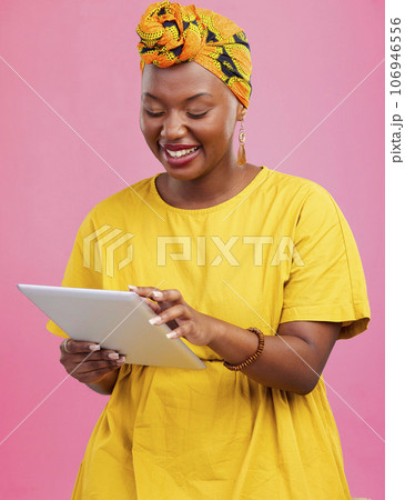 Black woman, tablet and communication, app and social media with chat, internet search and wireless in studio. Scroll online with smile, African user with tech and touchscreen on pink background Black woman, tablet and communication, app and social media with chat, internet search and wireless in studio. Scroll online with smile, African user with tech and touchscreen on pink background 106946556