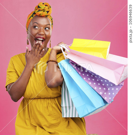 Shopping bag, studio and black woman surprise over discount notification, sales announcement or commerce deal. Wow, package gift and African customer shocked with retail news offer on pink background 106946639
