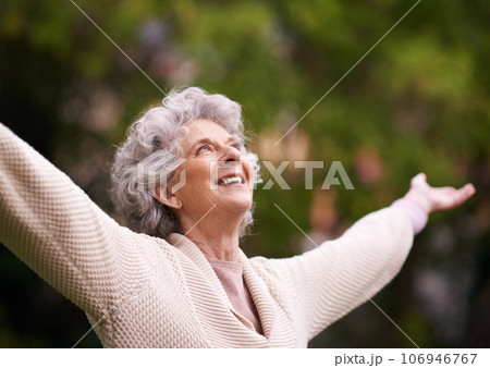 Senior woman, happiness and open arms to enjoy outdoors, nature or garden in financial freedom, success or life achievement. Retired lady, healthy or smiling pensioner stretching in retirement joy 106946767