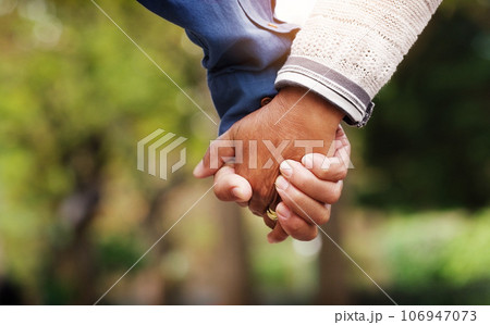Love, closeup senior couple holding hands and in a park nature background. Support or care, bonding or quality time and married old people outdoors together in a garden or in green environment. 106947073