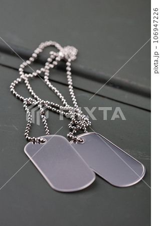 US army dog tags on green ammo can 106947226