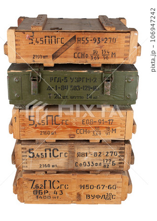 Army ammunition stack of wooden crates. Text in russian - type of ammunition, projectile caliber, projectile type, number of pieces and weight. Army ammunition stack of wooden crates. Text in russian - type of ammunition, projectile caliber, projectile type, number of pieces and weight. 106947242