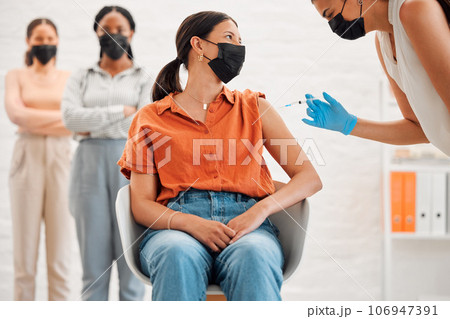 Vaccine, injection and medicine treatment for covid, flu and pandemic disease with nurse, healthcare or medical professional. Stylish, edgy and creative office woman with mask getting injected in arm 106947391