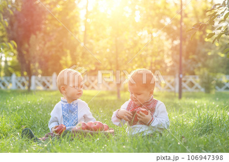 Children in summer in Ukrainian national dress - vyshyvanka in nature Children in summer in Ukrainian national dress - vyshyvanka in nature 106947398