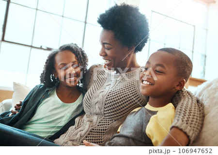Love, mother and children relax sofa for happy family time together in apartment in South Africa on weekend. Smile trust and support, black woman and kids sitting on couch with healthy relationship. Love, mother and children relax sofa for happy family time together in apartment in South Africa on weekend. Smile trust and support, black woman and kids sitting on couch with healthy relationship. 106947652