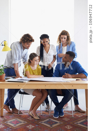 Creative business people, blueprint and meeting for document planning, architecture or construction at office. Architect group in project discussion with floor plan in team collaboration for startup Creative business people, blueprint and meeting for document planning, architecture or construction at office. Architect group in project discussion with floor plan in team collaboration for startup 106947712