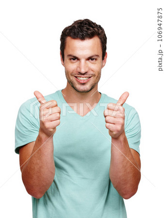 Thumbs up, happy and portrait of a man in a studio with success, good news and agreement. Happiness, smile and handsome male model with a yes, ok and approval gesture isolated by a white background. 106947875