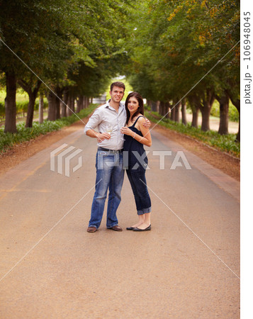 Couple, portrait and wine outdoor at a vineyard for vacation, holiday or travel with love and care. Man and a woman hug on a countryside road with trees, alcohol glass or drinks to celebrate marriage Couple, portrait and wine outdoor at a vineyard for vacation, holiday or travel with love and care. Man and a woman hug on a countryside road with trees, alcohol glass or drinks to celebrate marriage 106948045