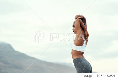 Woman, back stretching and yoga in mountain outdoor for workout and training with mockup. Wellness, nature and warmup with female person doing exercise for health with pilates and relax by a sky 106948054