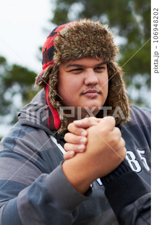 Man, arm wrestling and outdoor for sports, challenge and exercise with rival. Strong, conflict and people holding hands for competition, serious power and muscle match, training and workout at park. 106948202