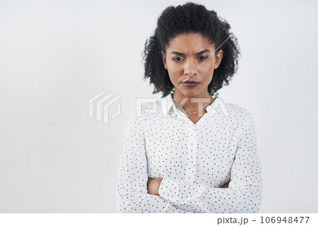 Angry, business and portrait of black woman with arms crossed in studio isolated on a white background mockup. Frustrated, face and African female professional, entrepreneur or person from Nigeria. 106948477