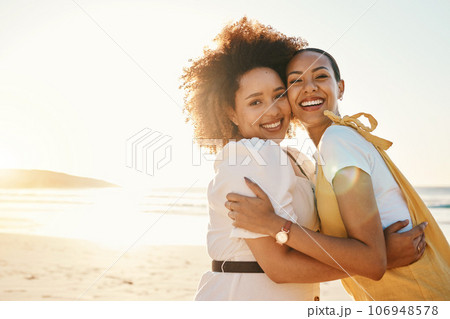Portrait, lgbt couple hugging on the beach at sunset together for romance or bonding on a date. Mockup, love and a gay woman with her lesbian girlfriend by the sea or ocean for honeymoon vacation Portrait, lgbt couple hugging on the beach at sunset together for romance or bonding on a date. Mockup, love and a gay woman with her lesbian girlfriend by the sea or ocean for honeymoon vacation 106948578