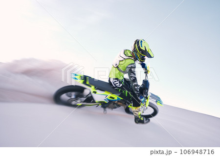 Bike, dust and speed with a sports man riding a vehicle in the desert for adventure or adrenaline. Motorcycle, training and freedom with an athlete on sand in nature for power or active competition Bike, dust and speed with a sports man riding a vehicle in the desert for adventure or adrenaline. Motorcycle, training and freedom with an athlete on sand in nature for power or active competition 106948716