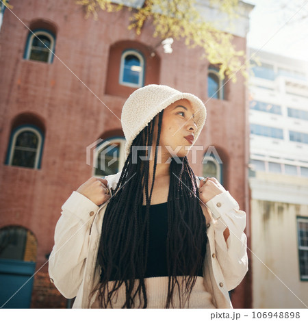 Woman, travel and gen z fashion in city with thinking and freedom from urban adventure in New York, African female teenager relax, streetwear clothes and outdoor on a journey in town on a trip 106948898