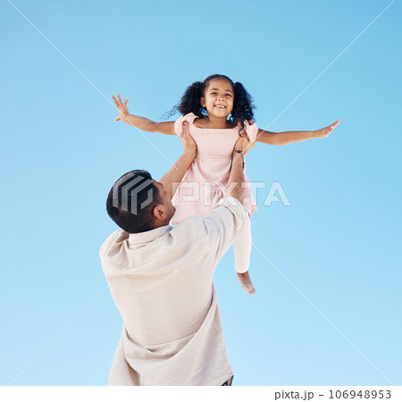 Portrait, blue sky and a child with dad for playing, lifting freedom and together in summer. Fun, family and a girl kid with a dad holding for flying, love and bonding on a vacation as happy people Portrait, blue sky and a child with dad for playing, lifting freedom and together in summer. Fun, family and a girl kid with a dad holding for flying, love and bonding on a vacation as happy people 106948953