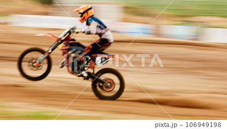 Motorcycle, balance and motion blur with a man training for a race or dirt biking challenge on space. Bike, fitness and power with a person driving fast on an off road course for freedom or speed 106949198