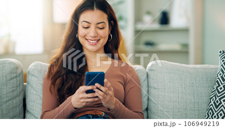 Phone, social media and happy woman texting on a dating app and smiling on the weekend at home on the couch. Smile, chatting and young girl loves typing a message on a social networking website Phone, social media and happy woman texting on a dating app and smiling on the weekend at home on the couch. Smile, chatting and young girl loves typing a message on a social networking website 106949219