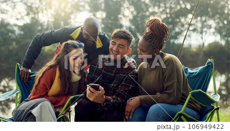 Camping, friends and people with phone in nature on outdoor holiday, vacation and adventure. Campsite, travel and men and women by lake on mountain on smartphone for social media, online and internet Camping, friends and people with phone in nature on outdoor holiday, vacation and adventure. Campsite, travel and men and women by lake on mountain on smartphone for social media, online and internet 106949422