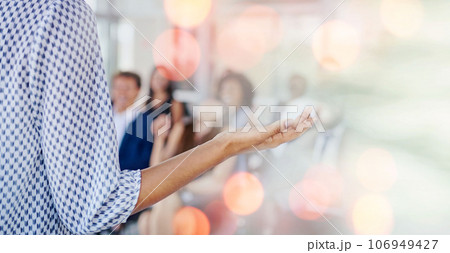 Person, speaker and presentation in meeting, seminar or conference for training staff against a bokeh background. Professional business leader talking to people, audience or workshop on mockup space Person, speaker and presentation in meeting, seminar or conference for training staff against a bokeh background. Professional business leader talking to people, audience or workshop on mockup space 106949427