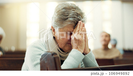 Worship, praying or old woman in church for God, holy spirit or religion in cathedral or Christian community. Faith, spiritual or elderly person in chapel sanctuary to praise Jesus Christ with hope 106949892