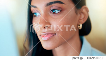 Business woman reading information on a computer screen while working in an office. Closeup on face of one confident young entrepreneur and focused expert carefully analyzing ideas and plans online 106950032