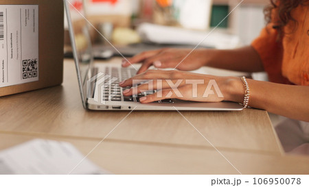 Hands, typing and laptop with boxes, logistics and e commerce in warehouse, workshop and shipping startup. Woman, computer and click for supply chain, store and cardboard package for delivery on desk 106950078
