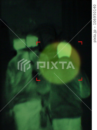 Military, enemy and target in night vision, overlay or dark green silhouette of spy, agent or terrorist risk to soldier. Police, surveillance and security people in infrared scope for army mission Military, enemy and target in night vision, overlay or dark green silhouette of spy, agent or terrorist risk to soldier. Police, surveillance and security people in infrared scope for army mission 106950140