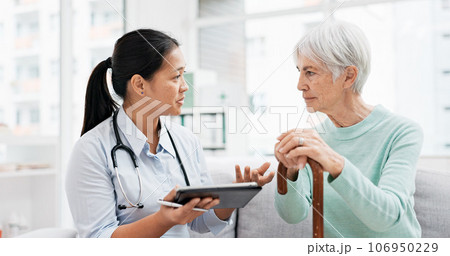 Talking, old woman or doctor with tablet for results, report or report history online in hospital in consultation. Support, healthcare or Asian nurse with medical update for elderly patient in clinic 106950229