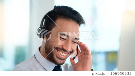 Call center agent consulting a buyer via video call in an office. A young friendly sales man talking to a client in a virtual meeting. A male customer service employee advising a consumer 106950233