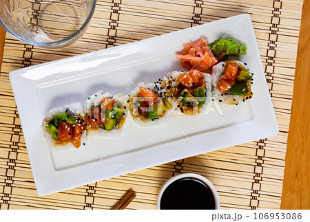 Saketaki rolls decorated with black sesame seeds, marinated ginger, wasabi, soy sauce Saketaki rolls decorated with black sesame seeds, marinated ginger, wasabi, soy sauce 106953086