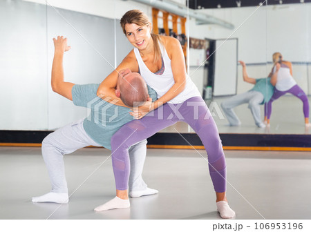 Woman makes a choke hold in self-defense training Stock Photo