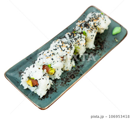 Juicy california roll on plate with chopsticks, wasabi and soy sauce 106953418