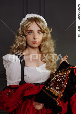 Medieval Seamstress with Vintage Dress. 106955029