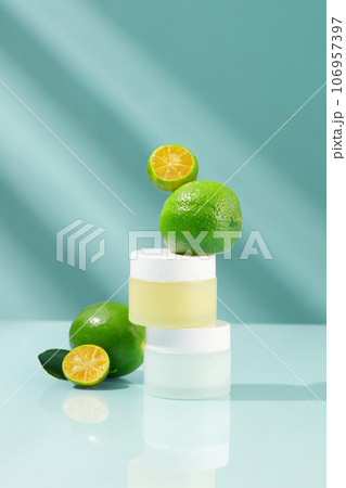 Two jars in pastel color stacked on each other with limes and kumquats featured. Eating Lime and Kumquat fruit or drinking juice provides a variety of health benefits Two jars in pastel color stacked on each other with limes and kumquats featured. Eating Lime and Kumquat fruit or drinking juice provides a variety of health benefits 106957397