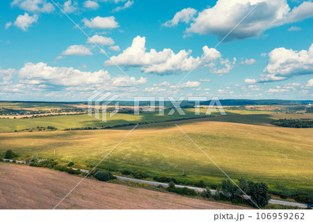 View from above of countryside. View of wheat and arable fields on a summer sunny day 106959262