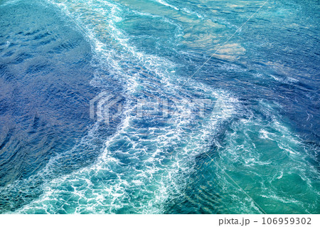 Whirlpool on a mountain river. The trial of the motorboat on the whirlpools in Saltstraumen. Abstract water background Whirlpool on a mountain river. The trial of the motorboat on the whirlpools in Saltstraumen. Abstract water background 106959302