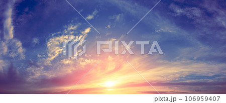 Panorama of a colorful cloudy sky at sunset. Sky texture. Abstract nature background 106959407