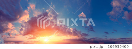 Panorama of a colorful cloudy sky at sunset. Sky texture. Abstract nature background 106959409